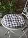 Round seat pad in quilted check._0
